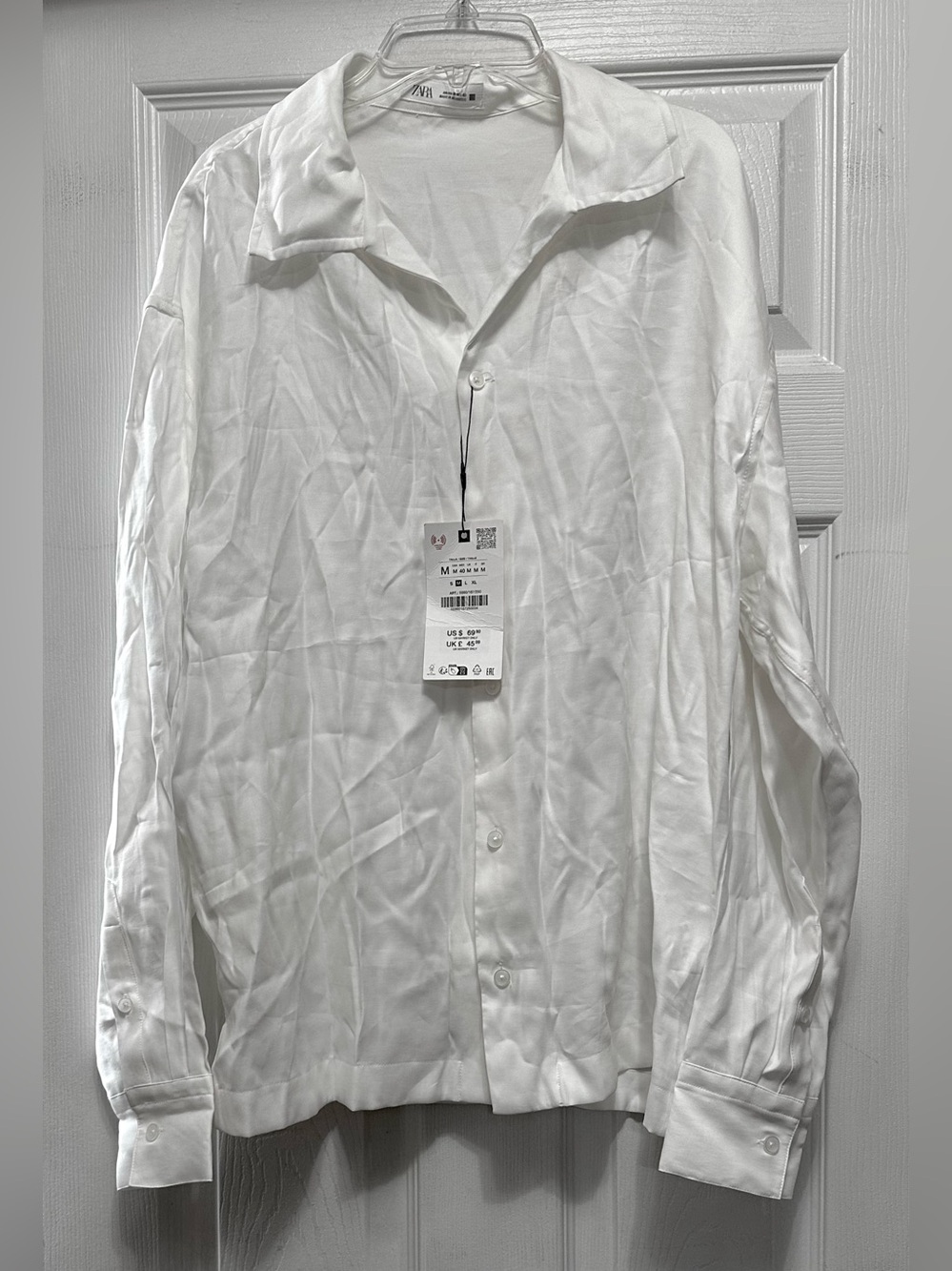 Zara white long-sleeve button-down shirt featuring a relaxed lapel Zara Wh